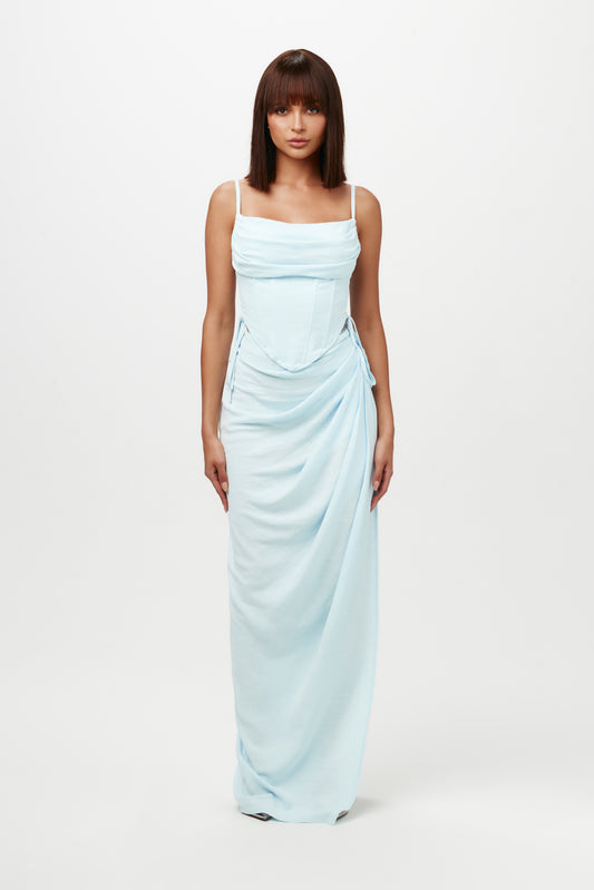 Crafted from lightweight linen, this maxi skirt features a high waist, side slit, and flowy appeal.