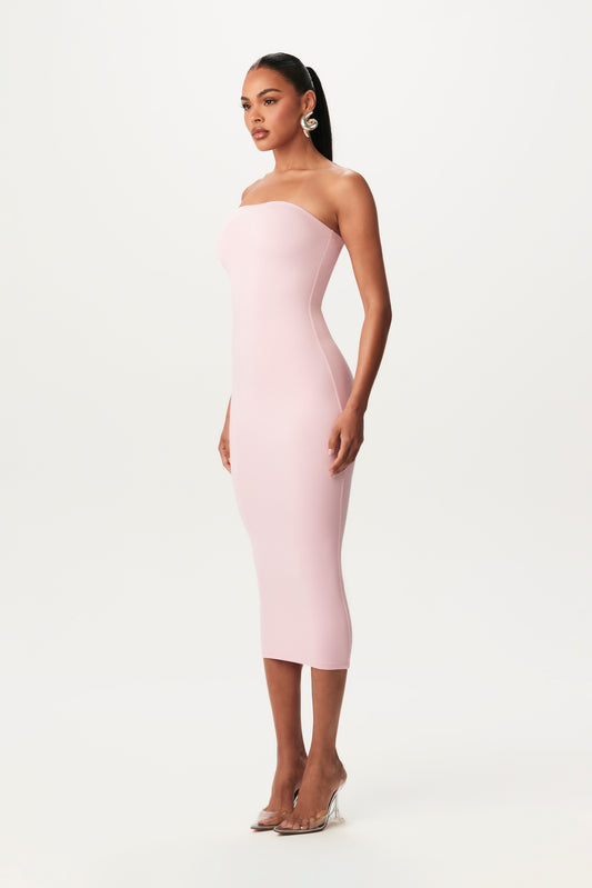 side-view of pink, bodycon midi strapless dress